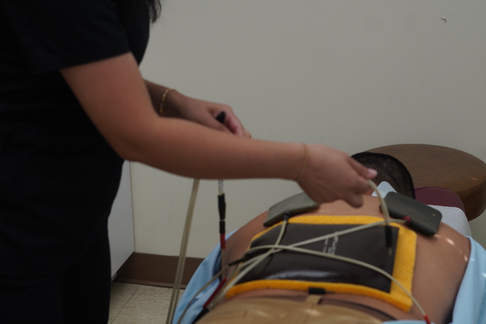 A person receiving a lower back adjustment at Levi Chiropractic